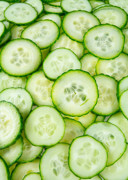 cut cucumbers isolated on white - Fotoğraf, Görsel