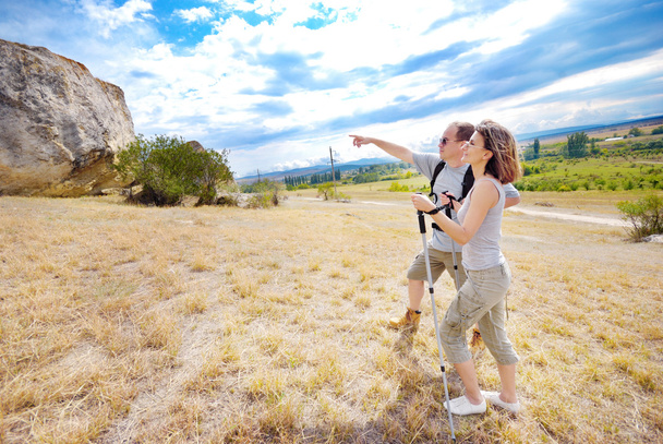 Adult man and woman are hiking - Valokuva, kuva