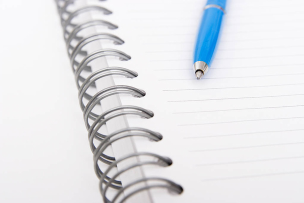 blue pen on notebook - Foto, Imagem