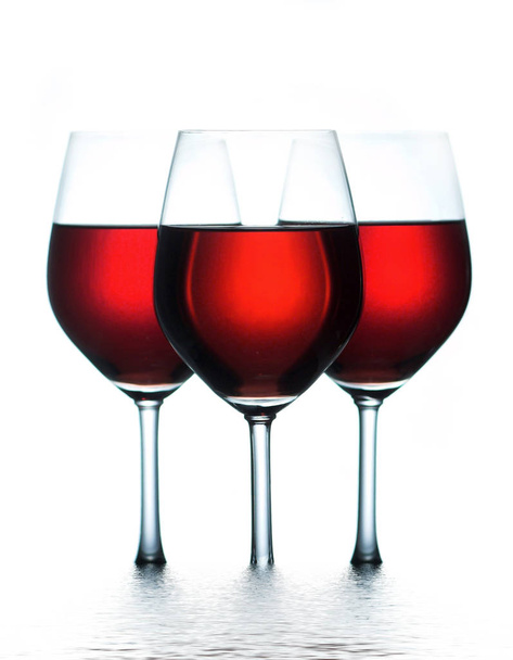 three red wine glasses,water effect - Foto, afbeelding