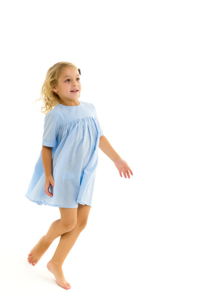 Cute little girl fun running around the room. Childrens games c - Photo, image