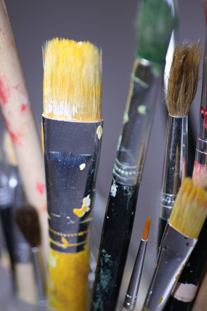 brushes and paints on the palette of the artist - Photo, Image
