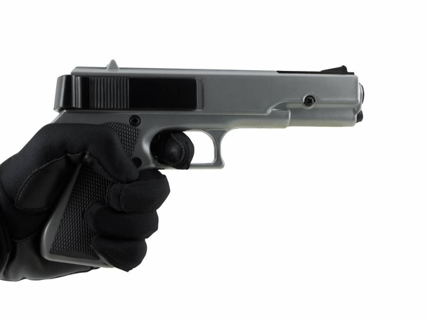 hand holding gun isolated on white - Φωτογραφία, εικόνα