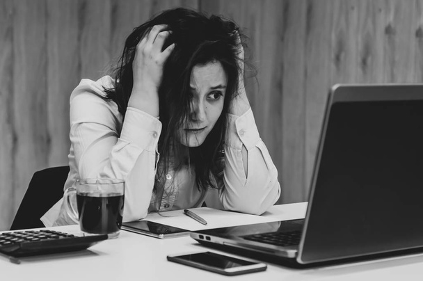 Desperate businesswoman worried hands in the head at office - Photo, Image