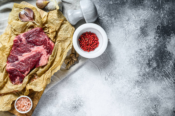Raw premium marbled beef black Angus. Organic farm meat. Gray background. Space for text - Foto, imagen