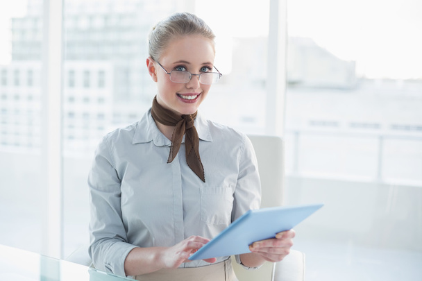 Blonde happy businesswoman holding tablet - Photo, Image