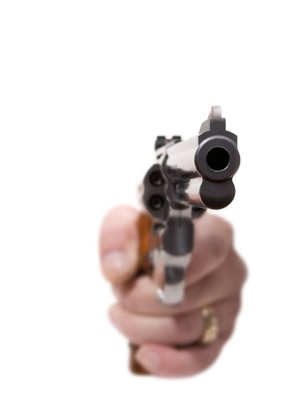 pistol in hand isolated on white - 写真・画像