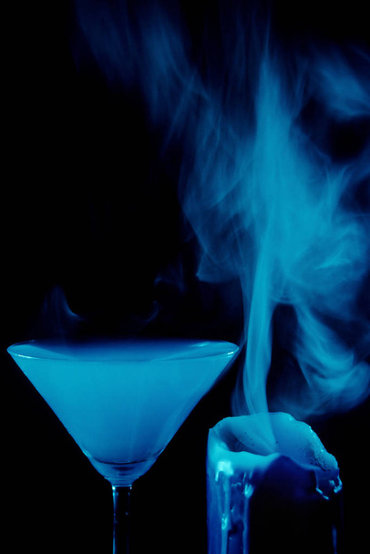 blue cocktail with ice and smoke - Fotó, kép