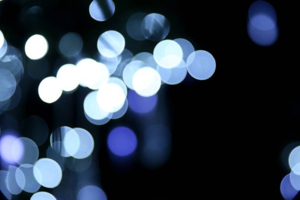 background with blurred circles of lights. defocused lights of festive garland  - Valokuva, kuva