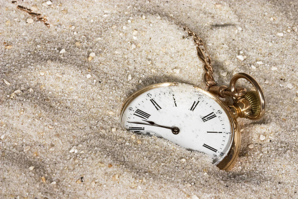 old pocket watch on the sand - Фото, изображение