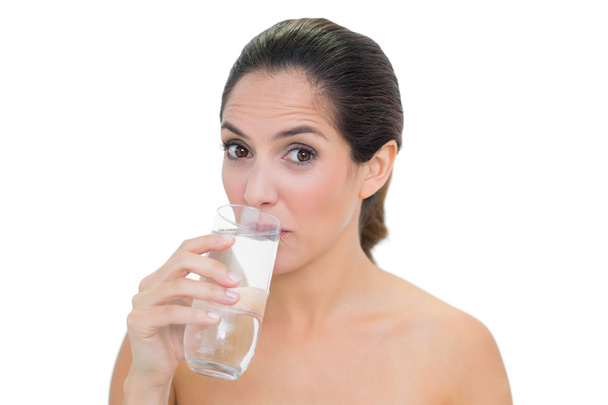 Content bare brunette drinking glass of water - Photo, image
