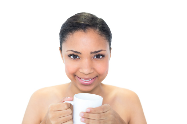 Content young model holding a mug of coffee - Valokuva, kuva