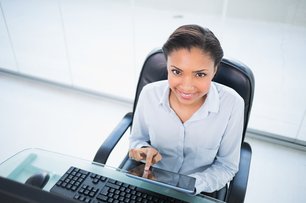 Cheerful young businesswoman using a tablet pc - Photo, image