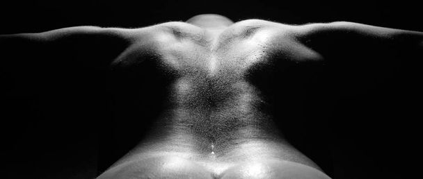 muscular man with naked torso on black background - 写真・画像