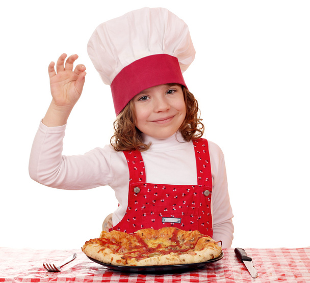 küçük kız yemek pizza ve ok el işareti ile - Fotoğraf, Görsel