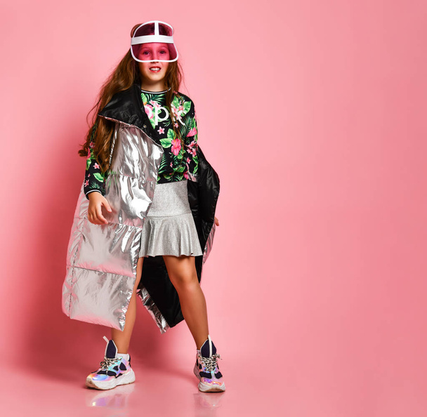 Young happy plus size girl model in stylish floral printed casual clothing, metallic coat, sneakers and modern accessories - 写真・画像