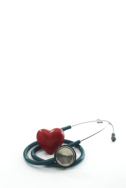 Red heart and a stethoscope on white - 写真・画像