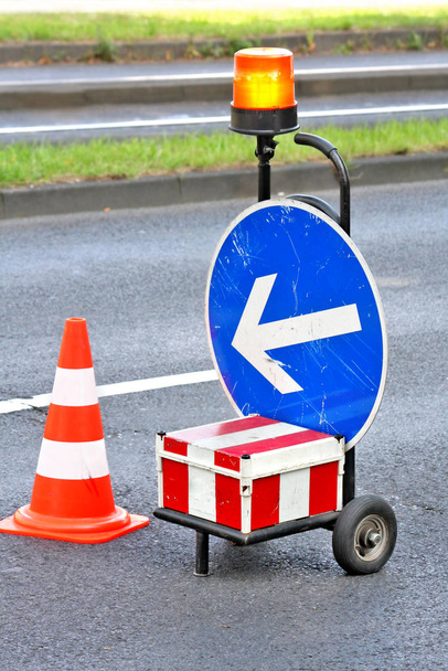 traffic cones and road sign on the street - Φωτογραφία, εικόνα