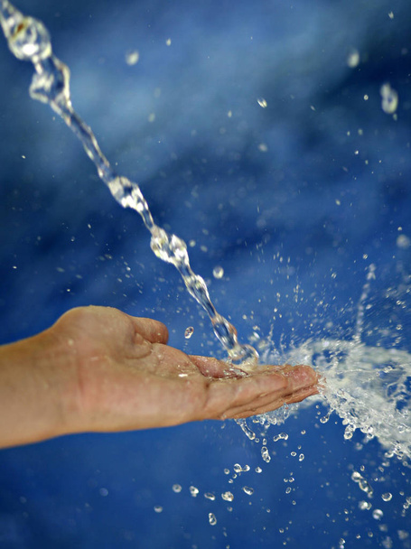 woman hand with a toothbrush in water - Foto, Imagen