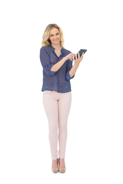 Cheerful pretty blonde holding calculator - Фото, зображення