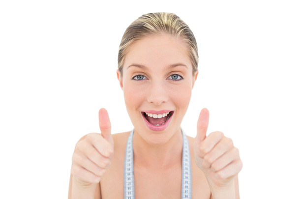 Delighted fresh blonde woman giving thumbs up - Fotoğraf, Görsel