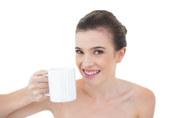 Joyful model holding a mug of coffee - Fotó, kép