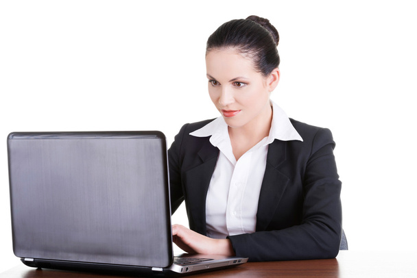 Businesswoman working on laptop computer - 写真・画像