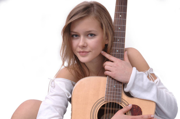young girl with a guitar - Фото, изображение