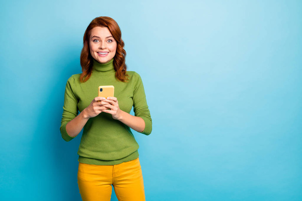 Portrait of her she nice attractive lovely cheerful cheery wavy-haired girl using cell chatting sending sms message isolated on bright vivid shine vibrant blue turquoise teal color background - Foto, immagini