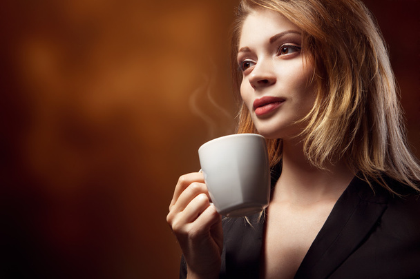 Beautiful Girl Drinking Tea or Coffee - Фото, зображення