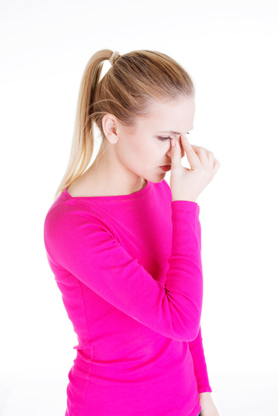 Young woman with sinus pressure pain - Foto, imagen