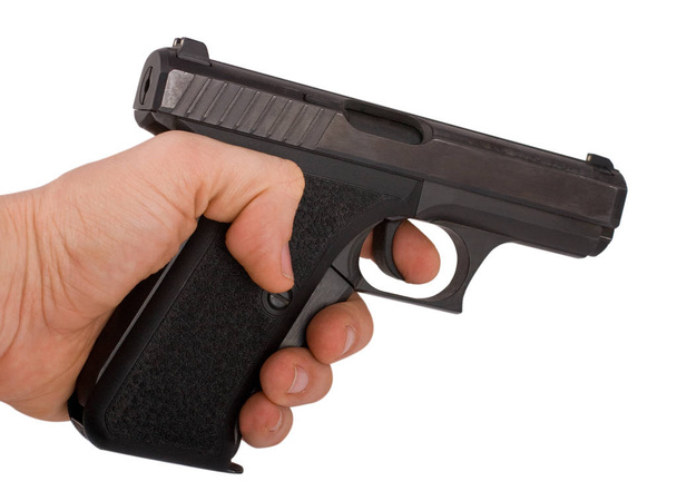 hand holding gun isolated on white - Φωτογραφία, εικόνα