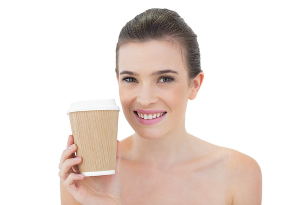 Pleased model holding a cup of coffee - Fotó, kép