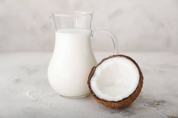 Tasty coconut milk on white background - Photo, Image