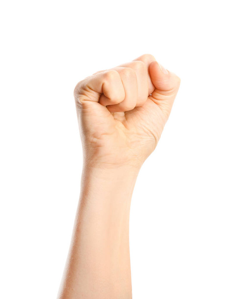 Hand of woman with clenched fist on white background - Photo, Image