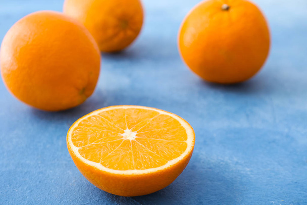 Sweet tasty oranges on color background - Photo, Image
