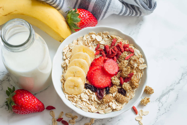 Breakfast oatmeal porridge with milk and fruits healthy food lifestyle  - Foto, afbeelding