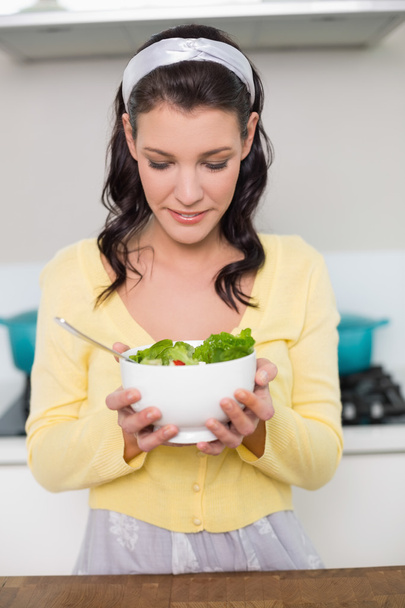 Peaceful gorgeous model holding healthy salad - 写真・画像