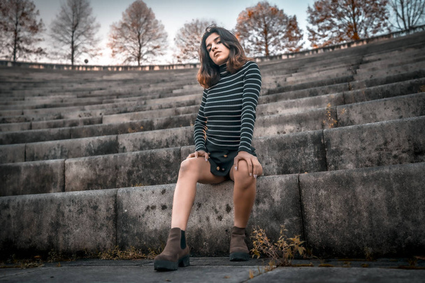 city portrait of beautiful young woman at amphitheatre - Fotografie, Obrázek