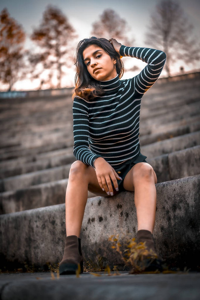 city portrait of beautiful young woman at amphitheatre - 写真・画像