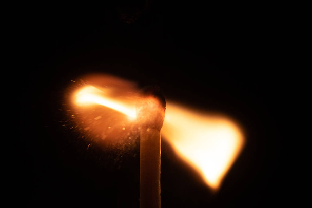 Ignition of match with sparks isolated on black background space for text fire concept passion figures variety - Photo, Image