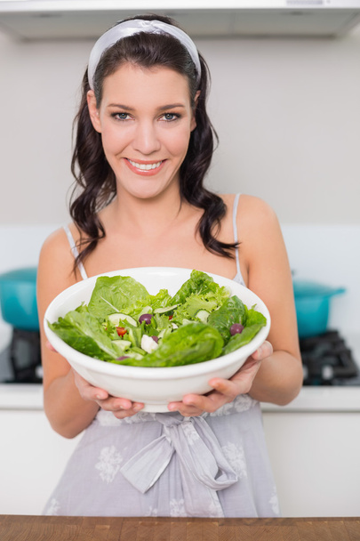 Cheerful pretty brunette showing healthy salad - Φωτογραφία, εικόνα