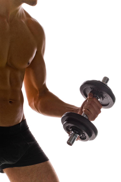muscular man with dumbbells - 写真・画像