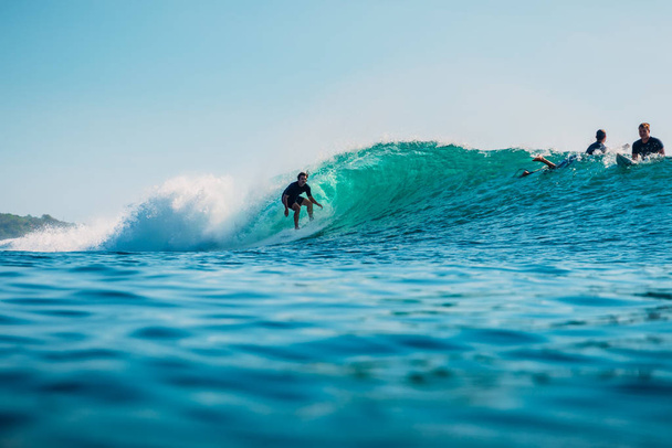 January 16, 2020. Bali, Indonesia. Surfer ride on ocean wave. Pr - Φωτογραφία, εικόνα