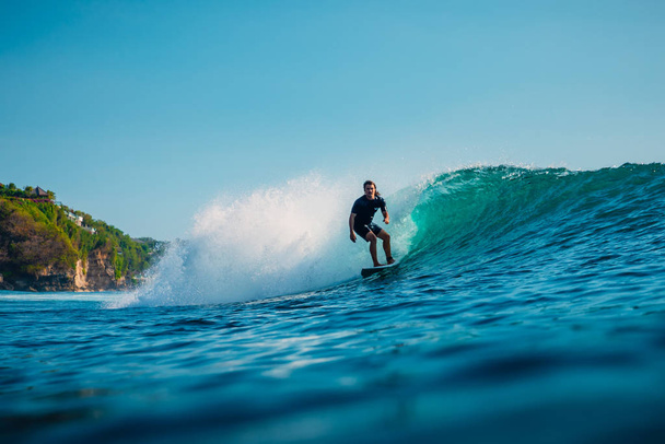 January 16, 2020. Bali, Indonesia. Surfer ride on ocean wave. Pr - Foto, Imagem