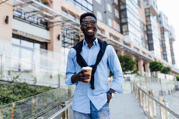 happy young man smiling at street, selective focus  - Photo, Image