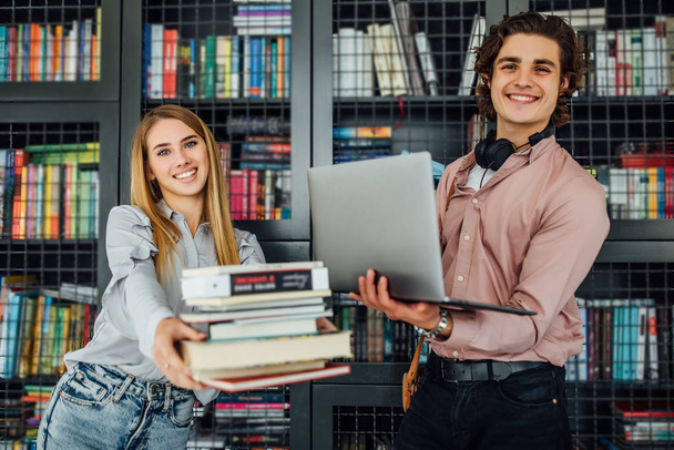 Two students at university library, selective focus - Fotografie, Obrázek