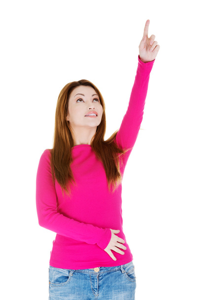Happy , excited woman pointing on copy space - 写真・画像