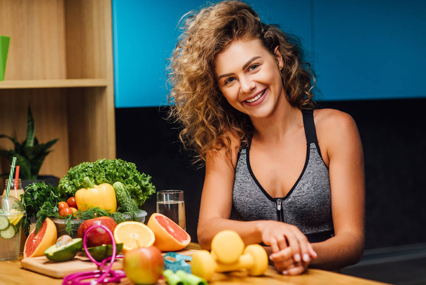 Beautiful woman with healthy green food at modern kitchen  - Fotoğraf, Görsel