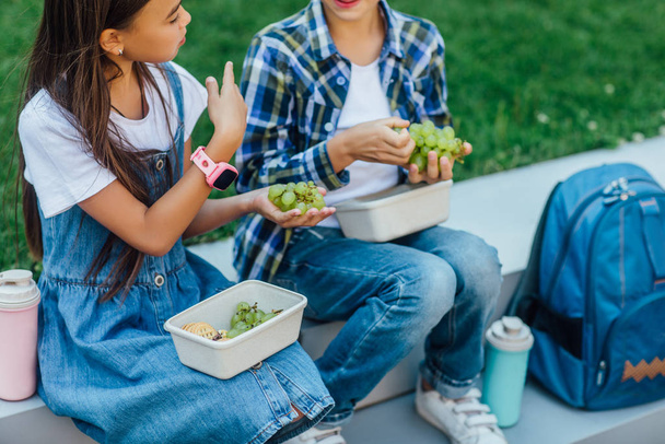 children during lunch outdoors, selective focus - Φωτογραφία, εικόνα